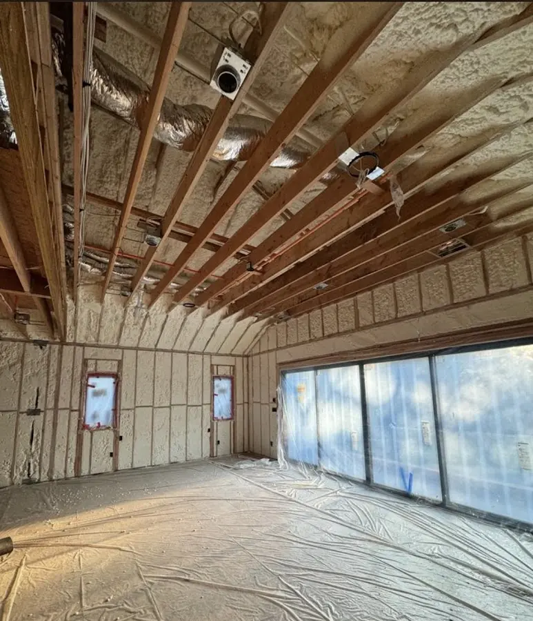 Interior walls and ceiling insulated with spray foam during new construction in Indian River Estates